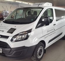 White Ford funeral transport vehicle belonging to Haron Funeral Agency