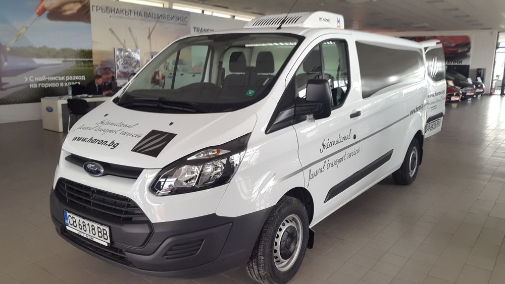 White Ford funeral transport vehicle belonging to Haron Funeral Agency